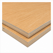 Two stacked plywood sheets with a light oak wood grain finish, showing the layered edges, on a solid white background.